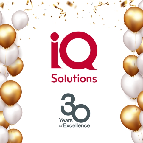 IQ Solutions 30 Years of Excellence with celebratory balloons
