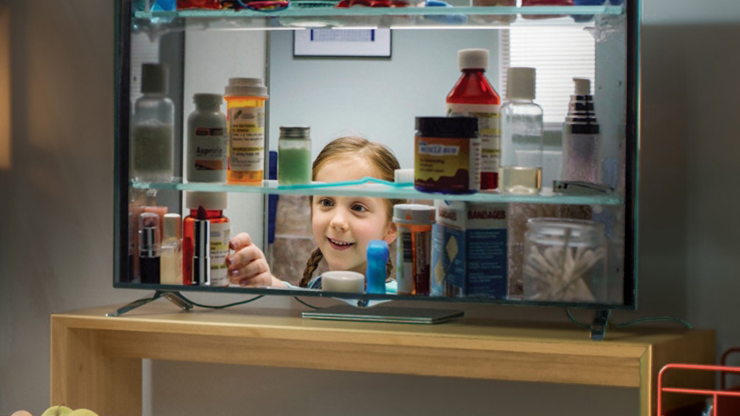 A still from a television promotion to remove the risk of unused opioids that depicts a child opening a medicine cabinet