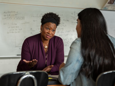 Educator meeting with a high school aged student